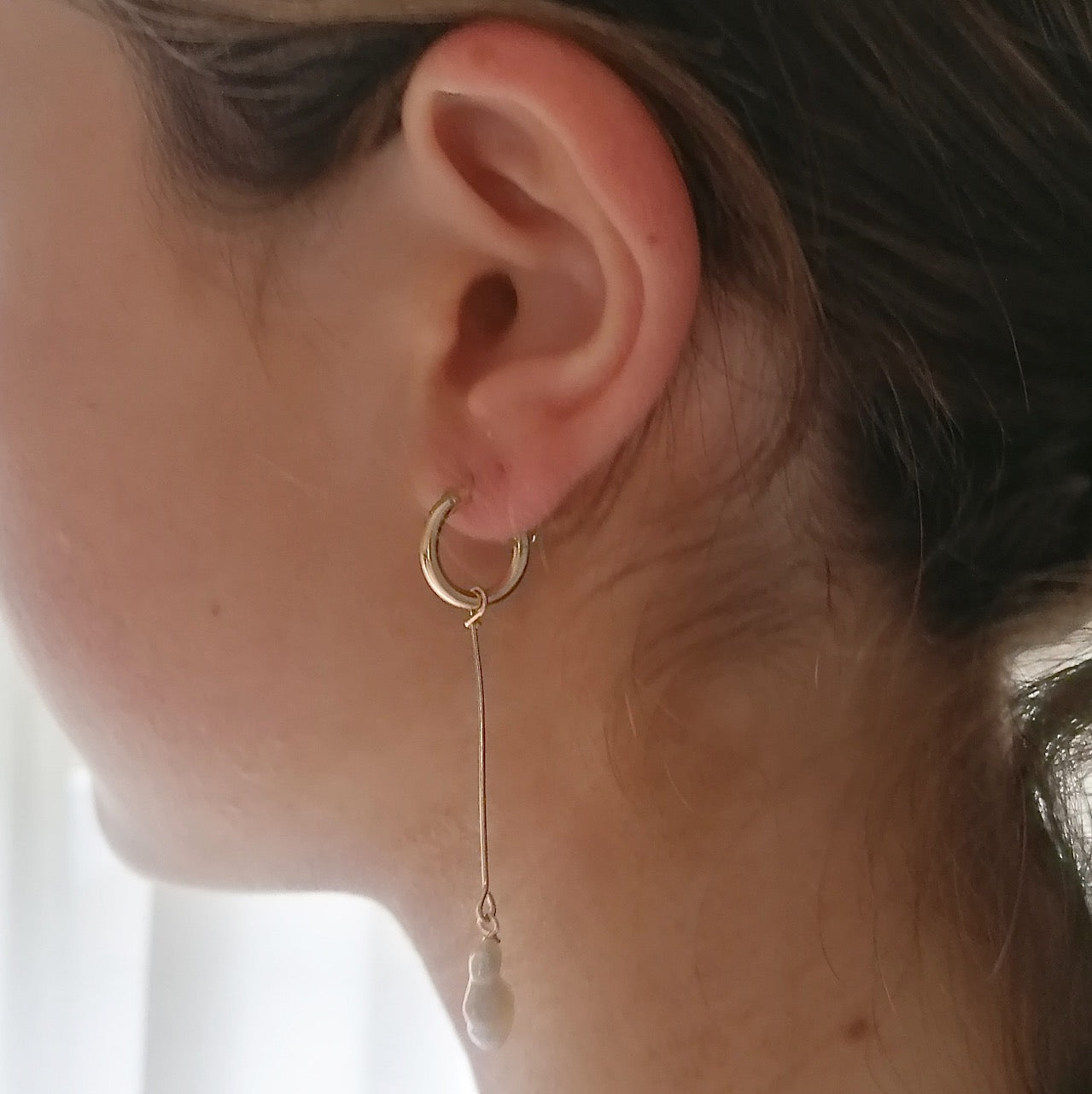 Long gold pearl earrings