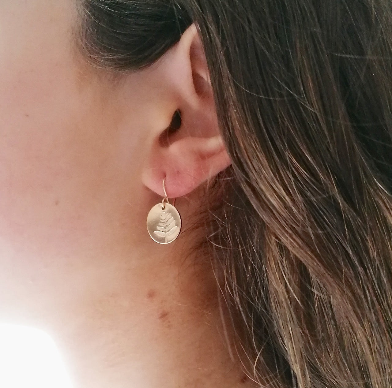 Gold fern disc earrings