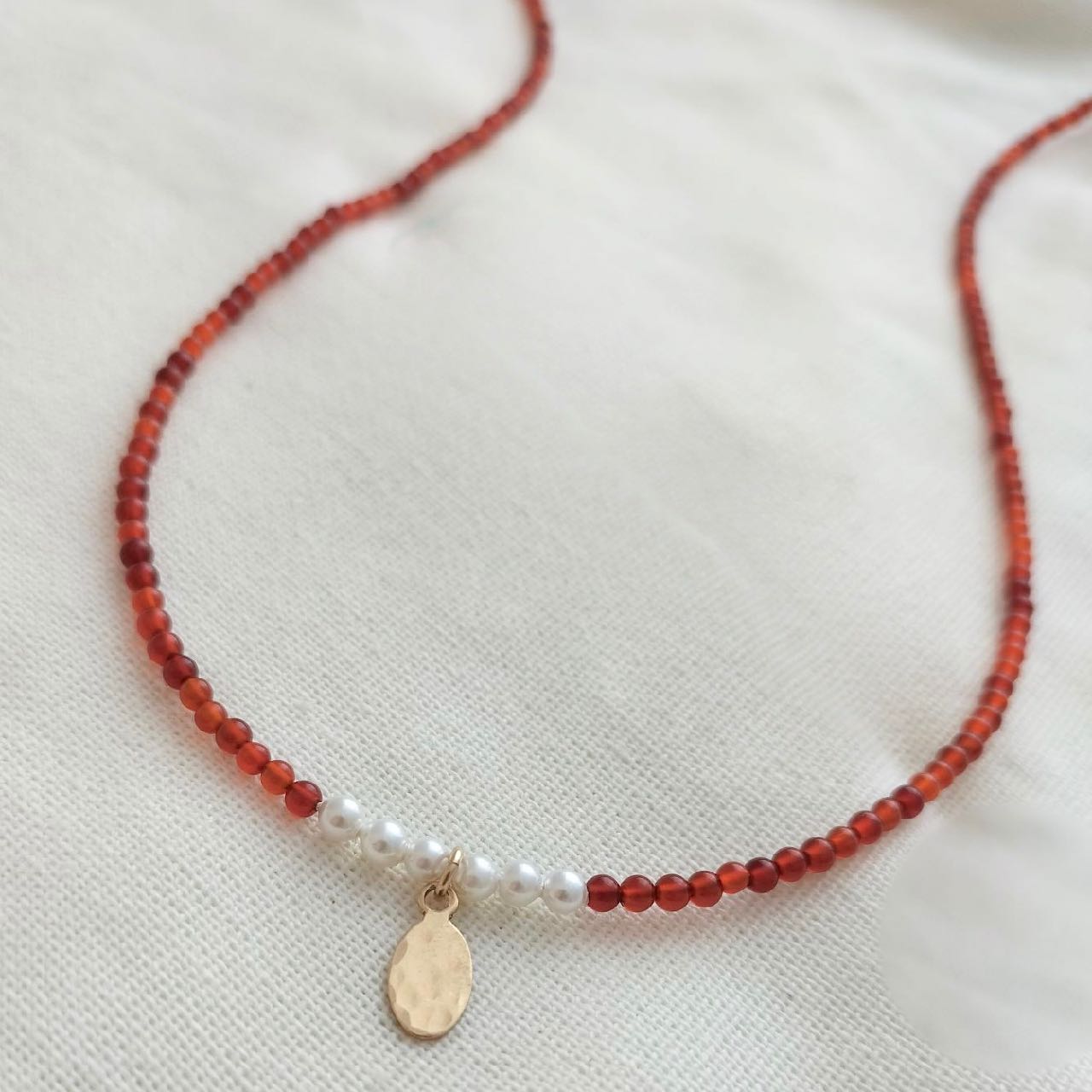 Carnelian and Pearl necklace with gold oval pendant