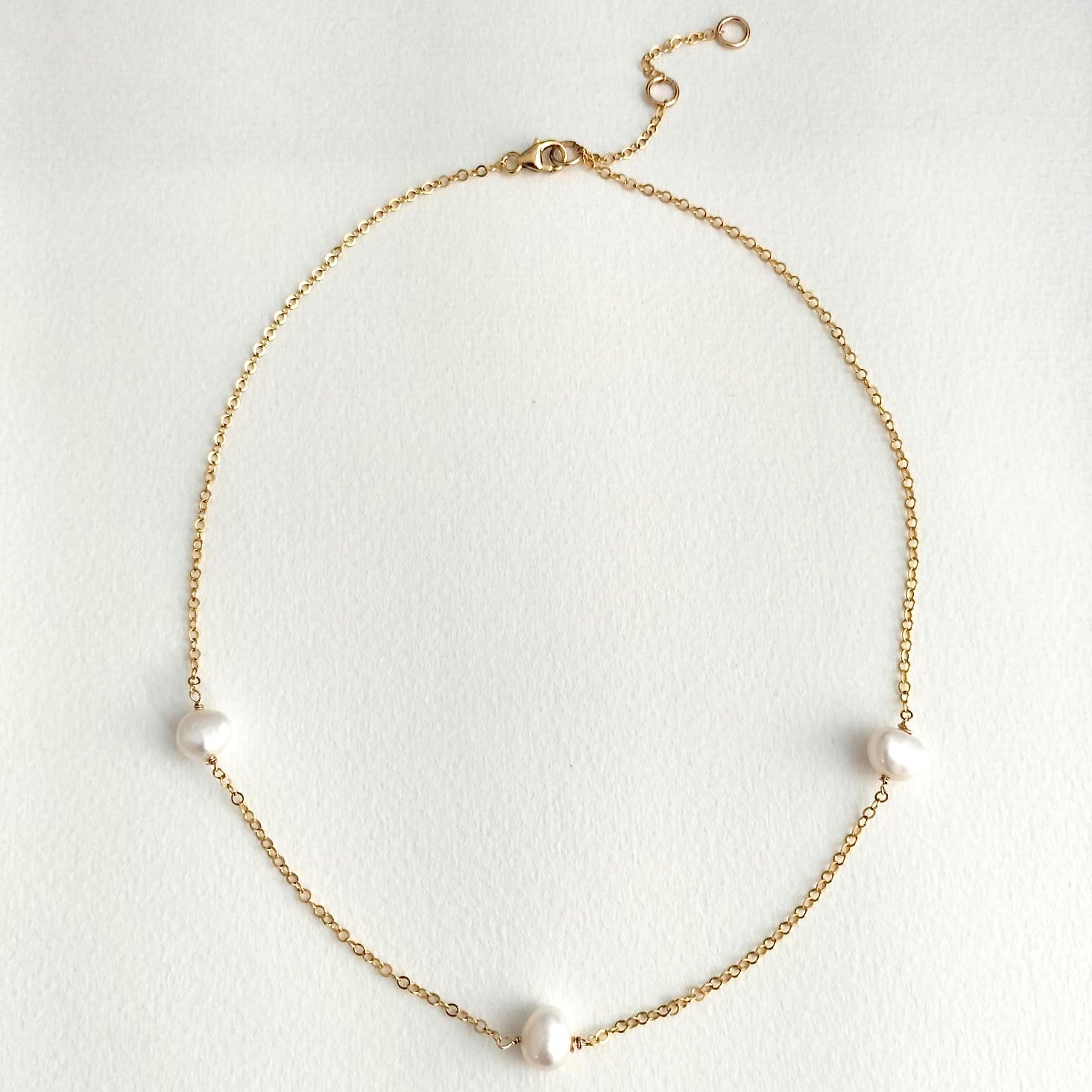 pearl necklace with three pearls