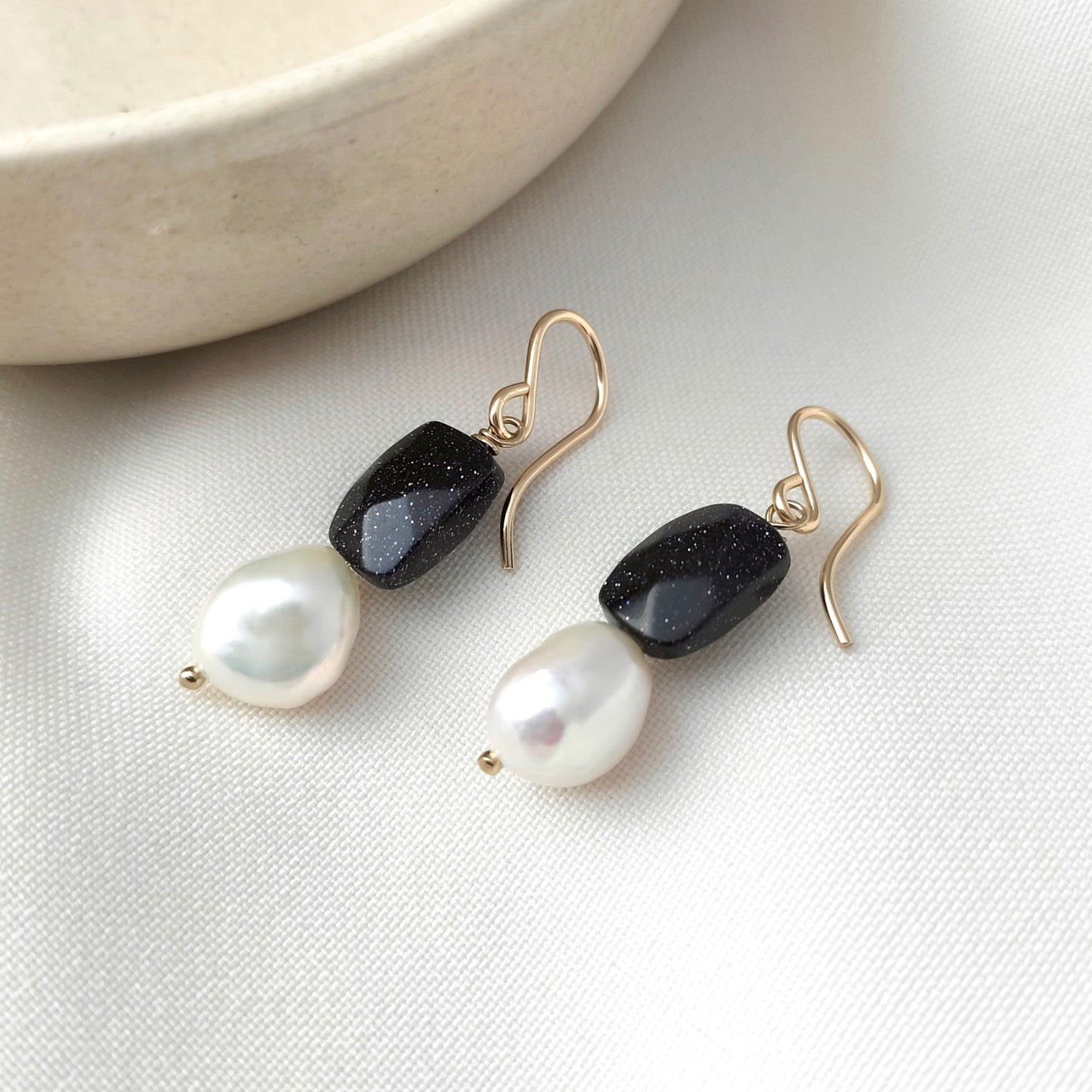 Dark blue sandstone and pearl dangly earrings