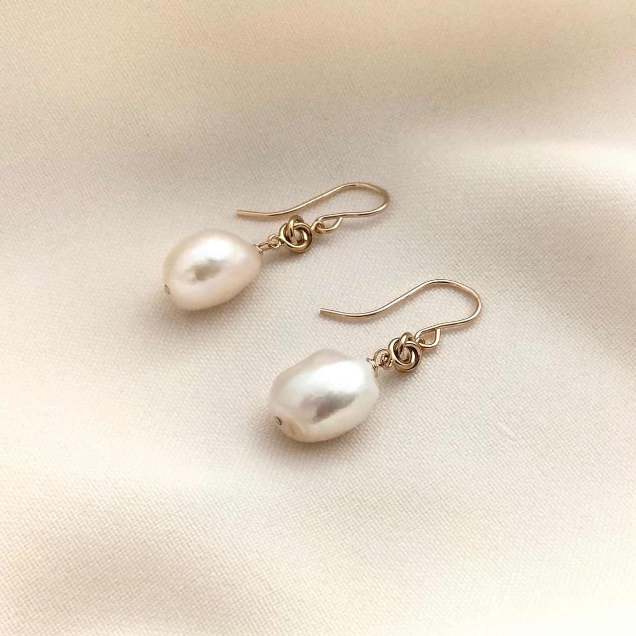 Gold love knot and pearl earrings
