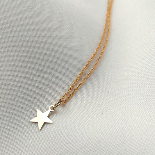 Tiny gold star necklace