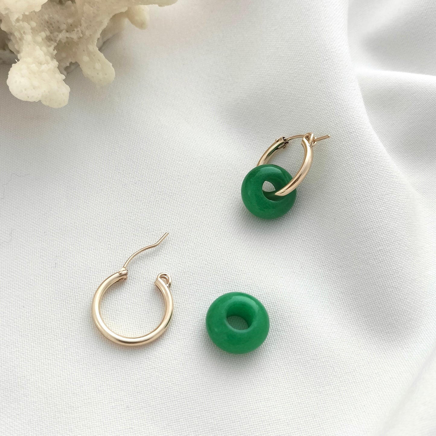 Gold hoop earrings with green jade beads