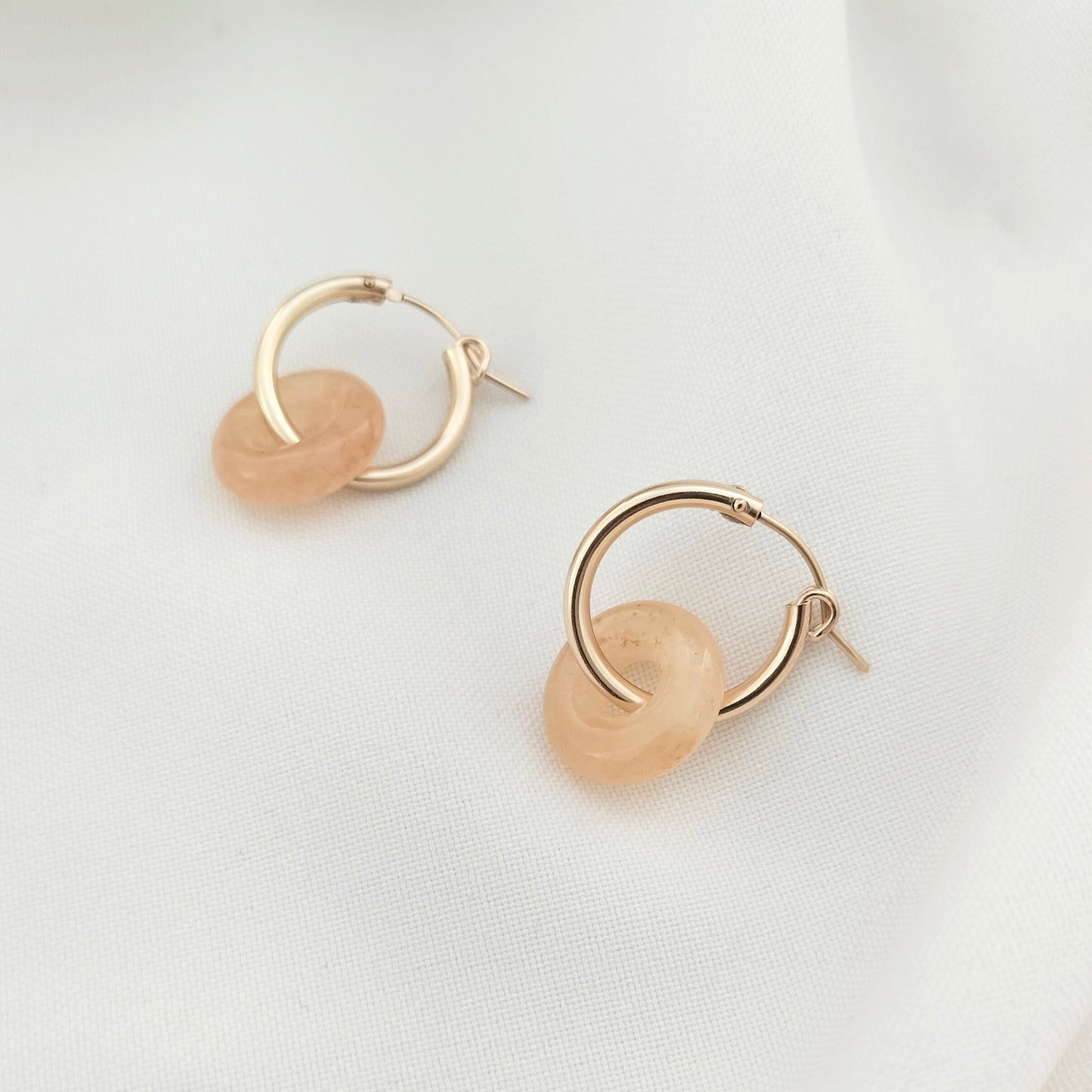 Gold hoop earrings with orange beads