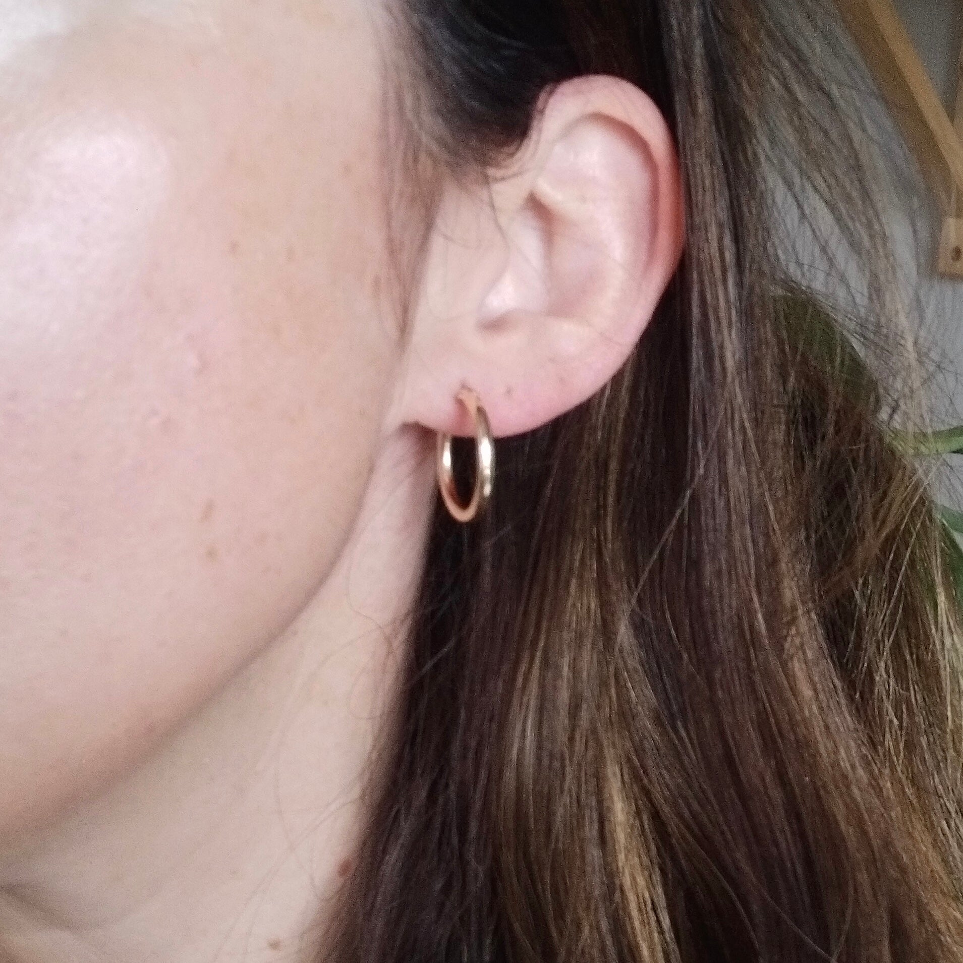 Medium gold hinged hoop earrings