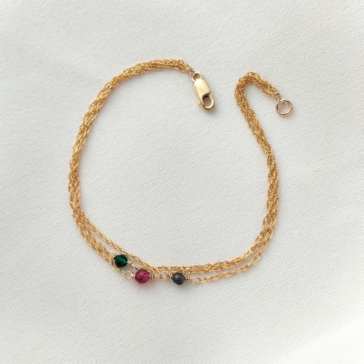 Triple strand jewel tone gemstone bracelet